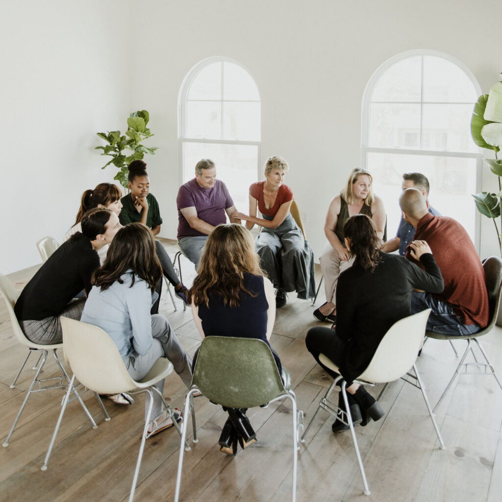 diverse people in a support group session