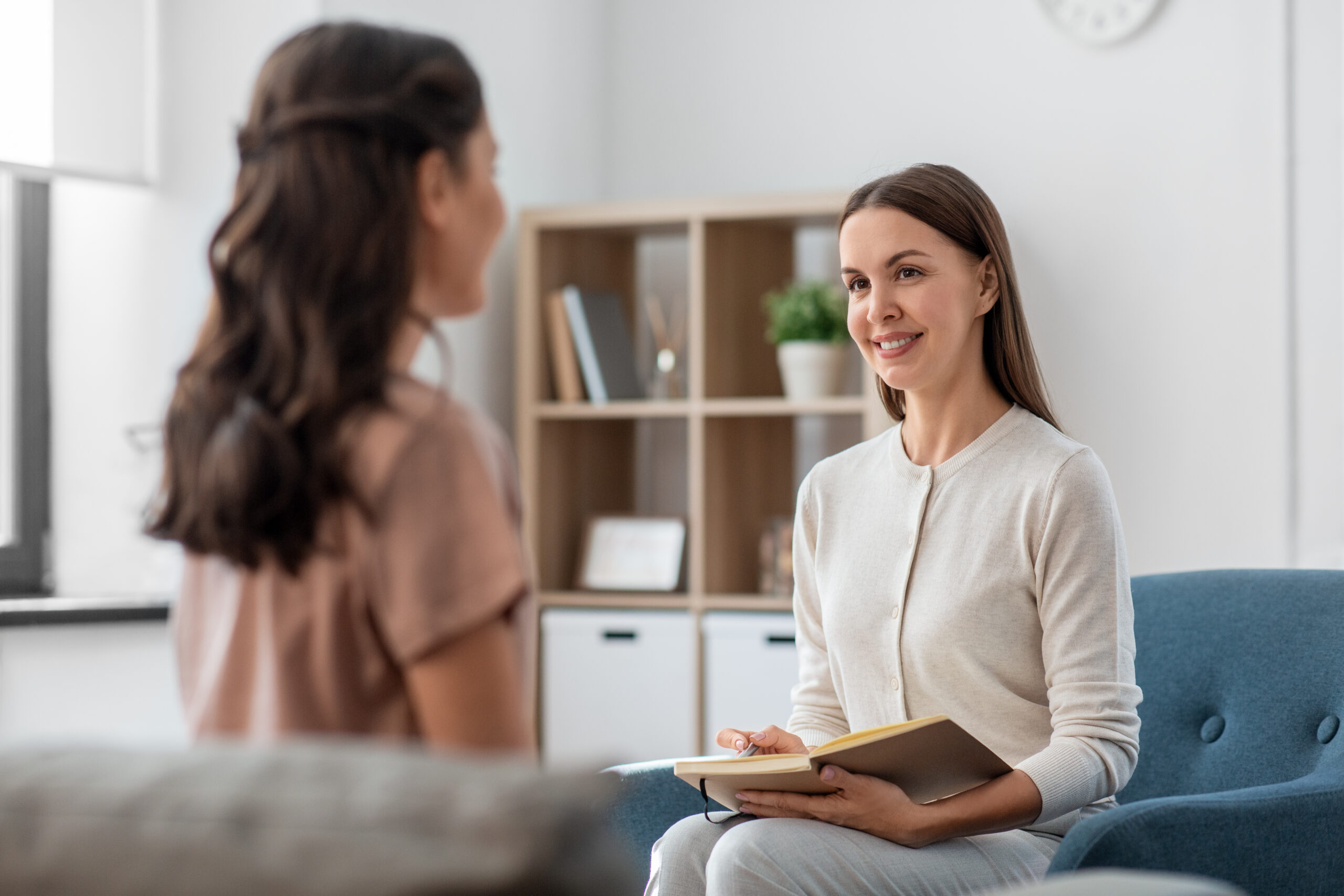 psychologist and woman at psychotherapy session
