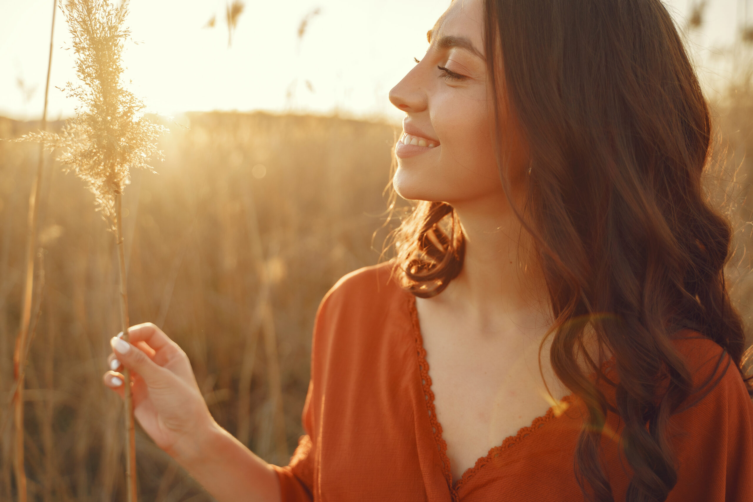 stylish woman spending time in a summer field